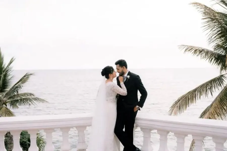 Couple on a seaside balcony - Endora Wedding Films