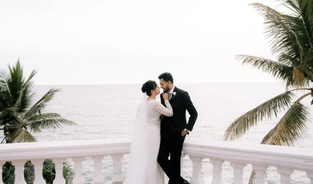 Wide shot of the couple on a balcony